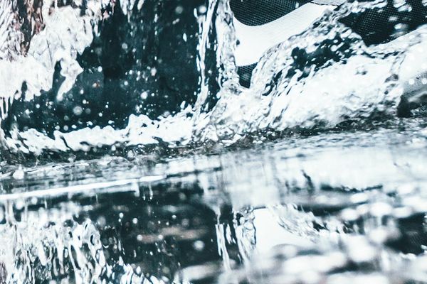 A person in motion, demonstrating a fluid exercise movement.