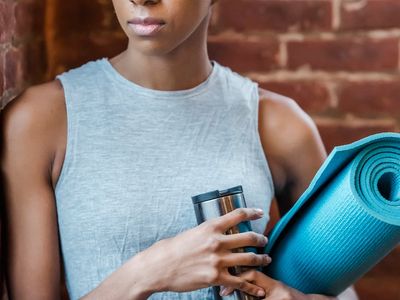Detail shot of an exercise mat and water bottle.